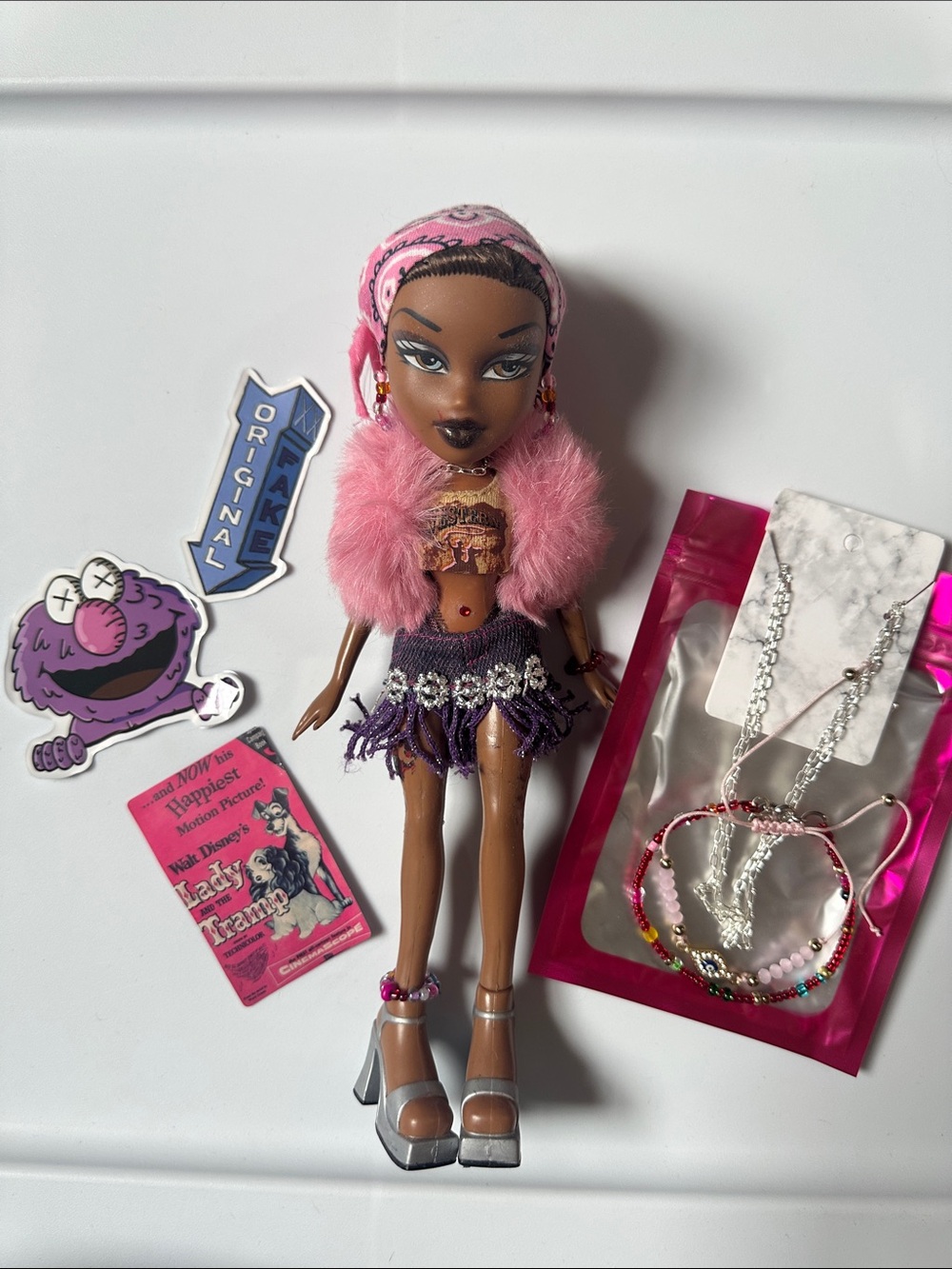 Fashion Doll with Pink Fur Jacket & Purple Fringe Skirt